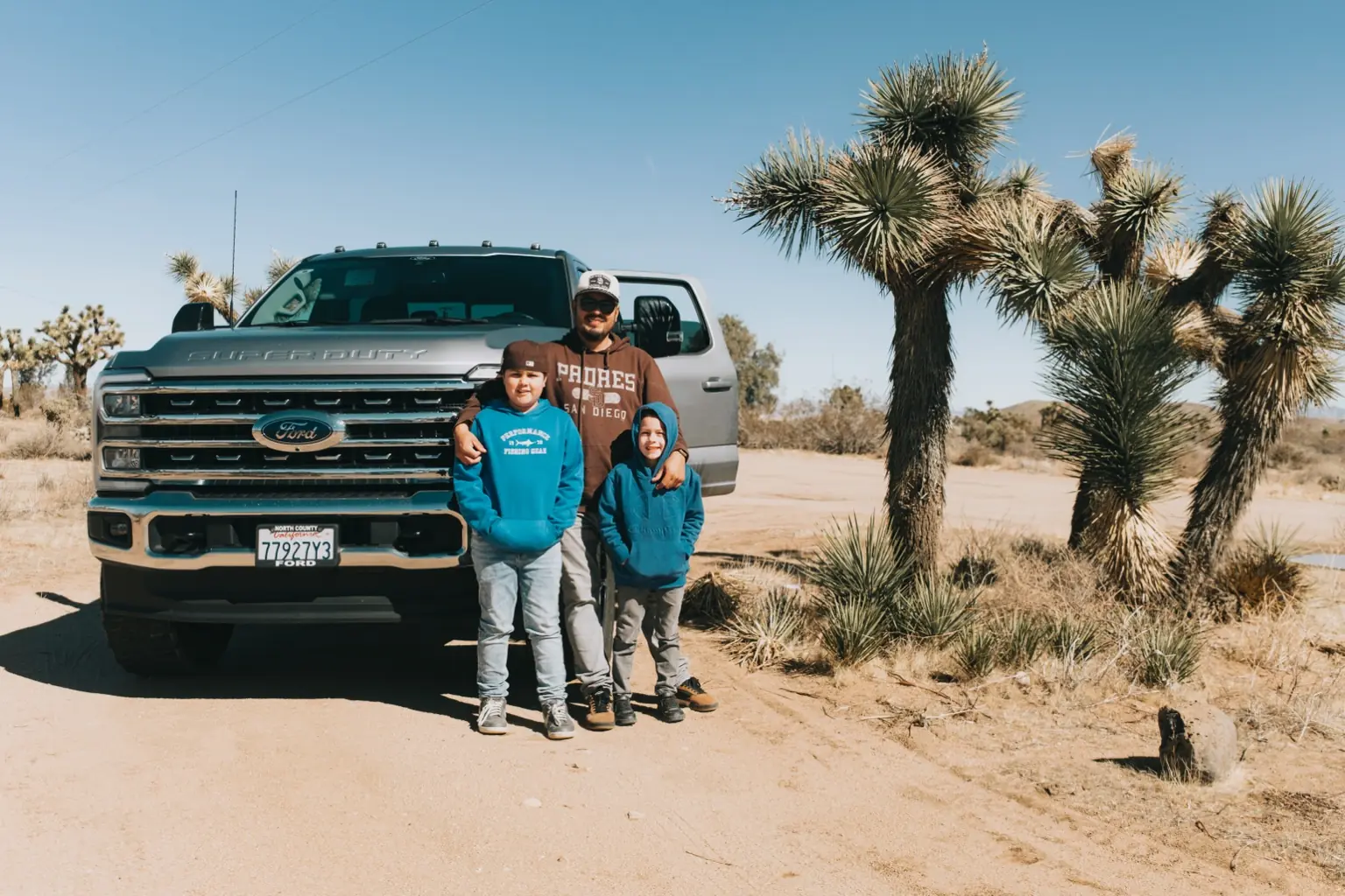 Javier Marquez with family beside an Active Framing work truck