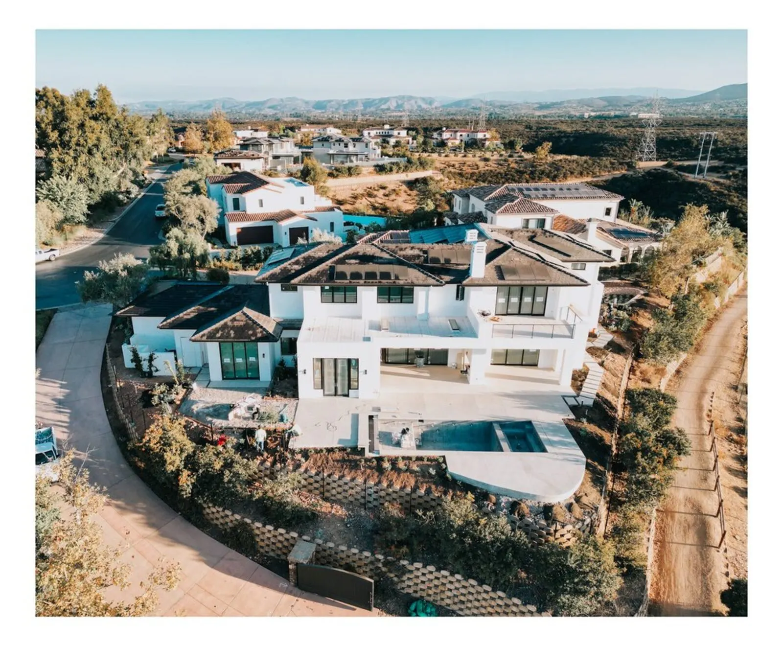 Aerial view of a finished framing structure with pool deck